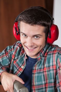 Man with protectors hearing