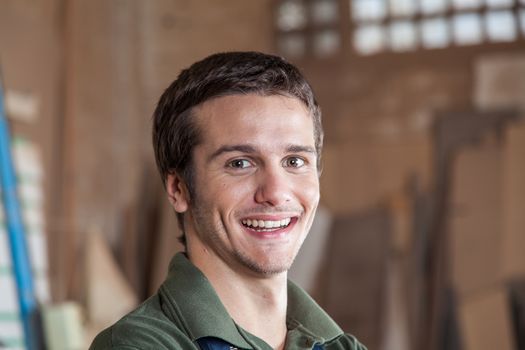 Smiling man in his workshop