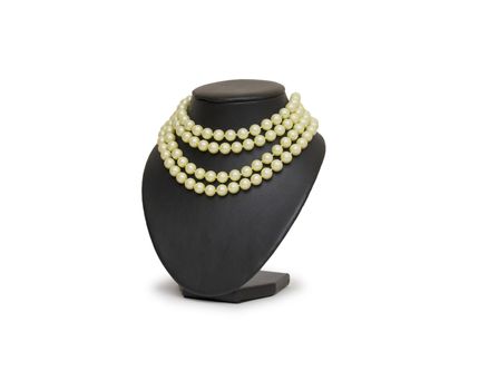 Pearl necklace on black mannequin isolated