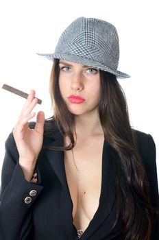 Confident young girl holds cigar. Young female model wears tail-coat and classic hat.