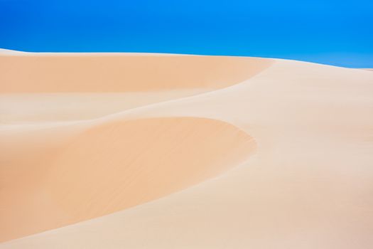 White sand dunes with blue skies, Mui Ne, Vietnam