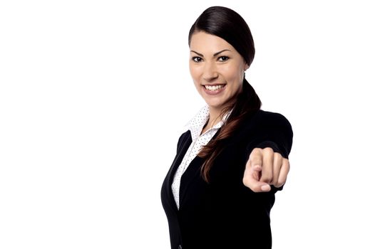 Happy businesswoman pointing her finger at you