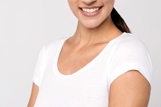 Cropped close up of young smiling woman