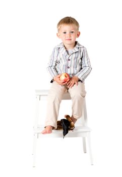 Boy in shirt shot in the studio on a white background