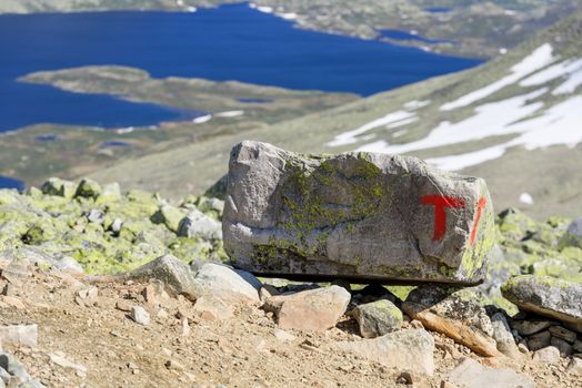 Signs of the Norwegian Trekking Association (Den norske turistforening, DNT) on the path to Gaustatoppen mountain (Norway)