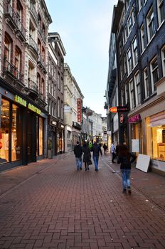 Amsterdam, Netherlands - May 7, 2015: Unidentified people Shopping on Kalverstraat, main shopping street of Amsterdam. Kalverstraat is usually crowded with many shops selling competitively priced products.