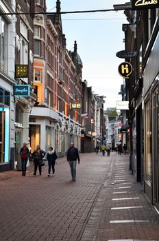 Amsterdam, Netherlands - May 7, 2015: Unidentified people Shopping on Kalverstraat, main shopping street of Amsterdam. Kalverstraat is usually crowded with many shops selling competitively priced products. 
