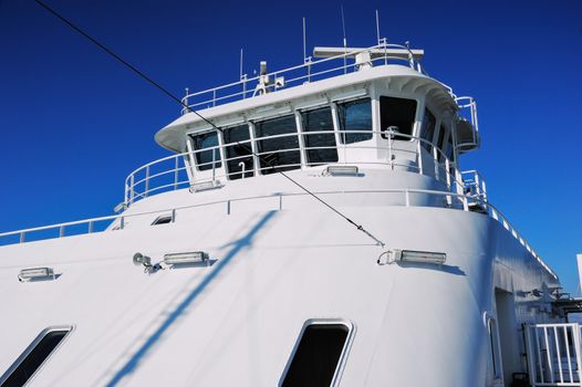 White yacht under deep blue sky