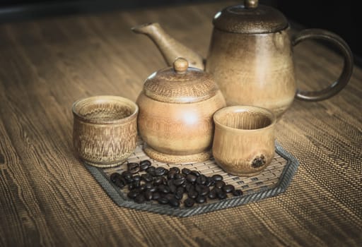 Vintage photo of coffee beans and Coffee cups set on wooden background.Vintage style.