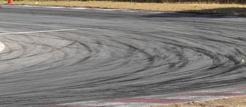 Background with tire marks on road track