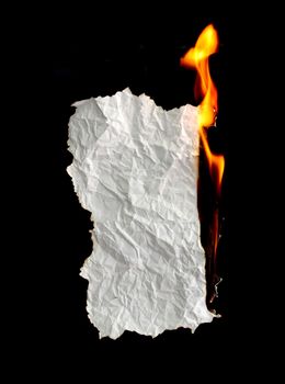 white crumpled  paper burning on black background