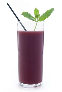 Acai berry smoothie in a glass with mint leaves over a white background