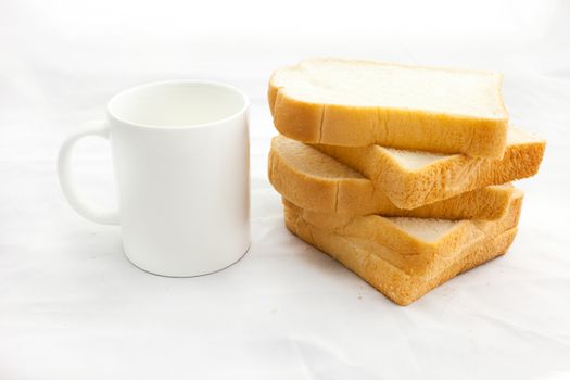 Empty coffee cup or coffee mug and sliced bread isolated on white background.