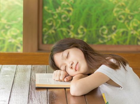 Asian girl sleeping while sitting at desk,Sleeping while learning