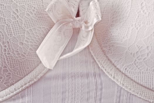 Close-up of white corsage with lace