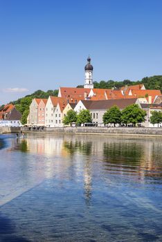 View of the town of Landsberg with the famous river Lech waterfall in Bavaria, Germany and free space in blue sky