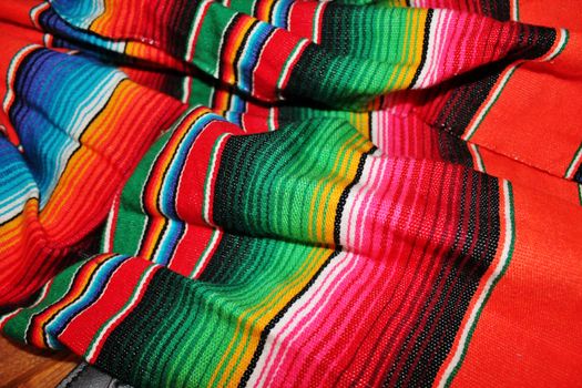 sequin and decorative ornate mexican hat ready for a fiesta with a gun