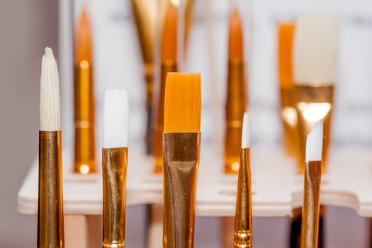 many brushes in art studio can be used as background
