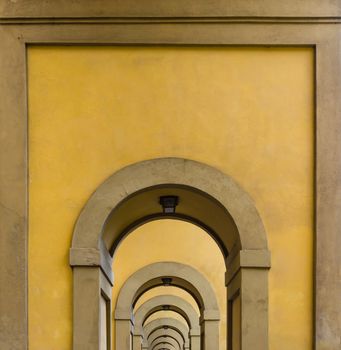 arches on the long way besides the river Arno in Florence