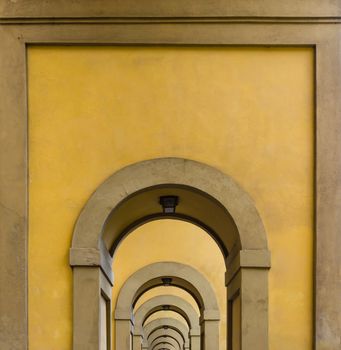 arches on the long way besides the river Arno in Florence