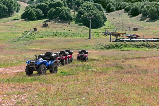 landscape of mountain with quad bike and chair lift