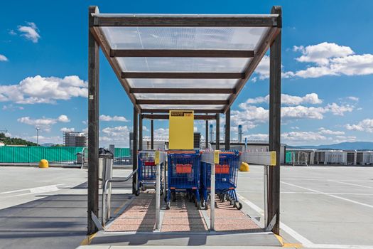 colored shopping carts in row