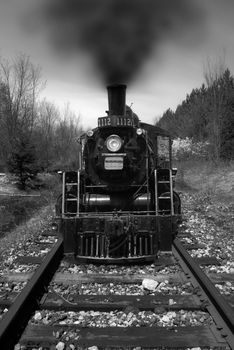 A long black train photographed in black and white.