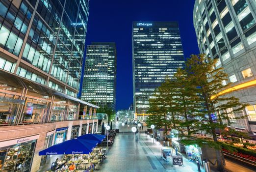 LONDON - JUNE 14, 2015: Lights of Canary Wharf buildings at night. Canary Wharf is the city financial district.