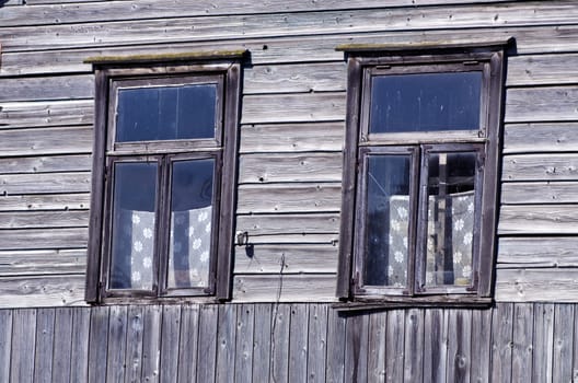 two old windows on farm wooden wall