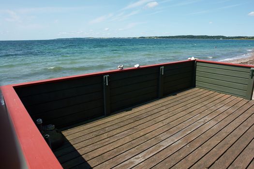 Wooden balcony terrace pf a lovely summer house with great view of the sea ocean