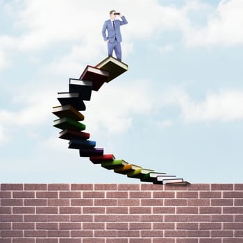 Businessman using binoculars against steps made out of books with open door