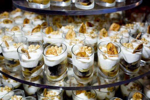 Dessert Finger Food with banana topping in small glass