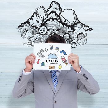 Businessman holding blank sign in front of his head against bleached wooden planks background