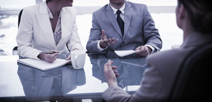 Business partners talking with their lawyer