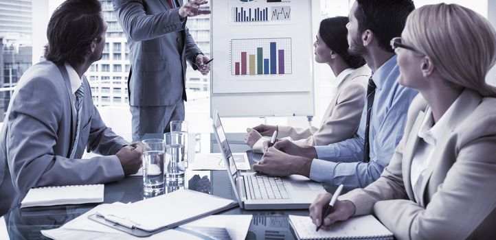 Young business people in board room meeting at the office