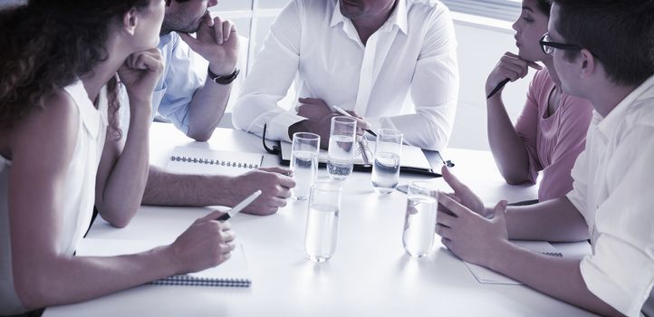 Business people discussing at conference table in office