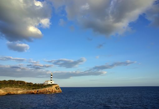 Typical mediterranean lighthouse in Porto Colom (Majorca - Spain)