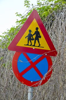 two colorful road school signs on street, Greece