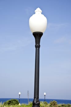 Aegean sea beach park lamps in Rhodes island, Greece