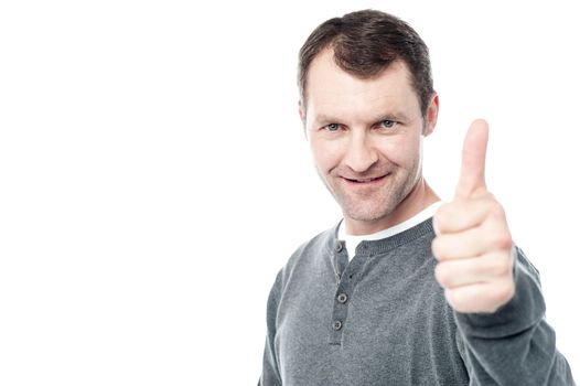 Man encouraging by showing thumbs up gesture