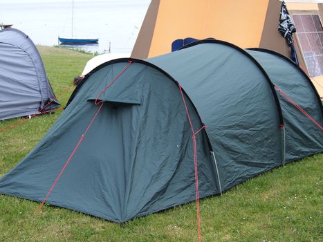 City of colorful tents in a sea beach camping site village