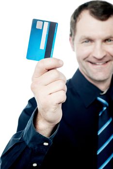 Cropped image of male executive showing credit card