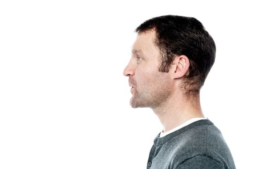 Side pose of middle aged man looking forward
