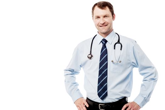 Confident male doctor with hands on waist