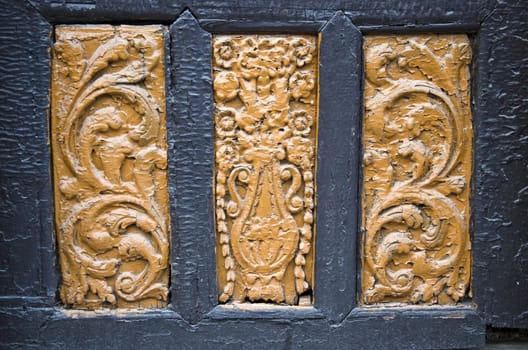 ancient wood carving on door background and texture. Rhodes, Greece