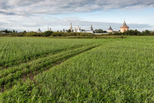 Spaso-Prilutsky monastery, blue sky and green meadow in summer Russia Vologda