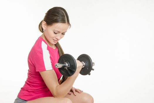 Young beautiful girl athlete spends Europeans physical exercise