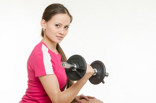 Young beautiful girl athlete spends Europeans physical exercise