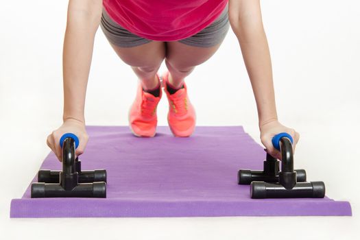 Young beautiful girl athlete spends Europeans physical exercise