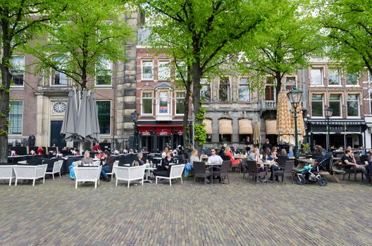 The Hague, Netherlands - May 8, 2015: Dutch People at Cafeteria in Het Plein in The Hague's city centre, Netherlands. on May 8, 2015.